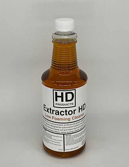 32oz Bottle of HD Extractor HD cleaning solution on a gray background