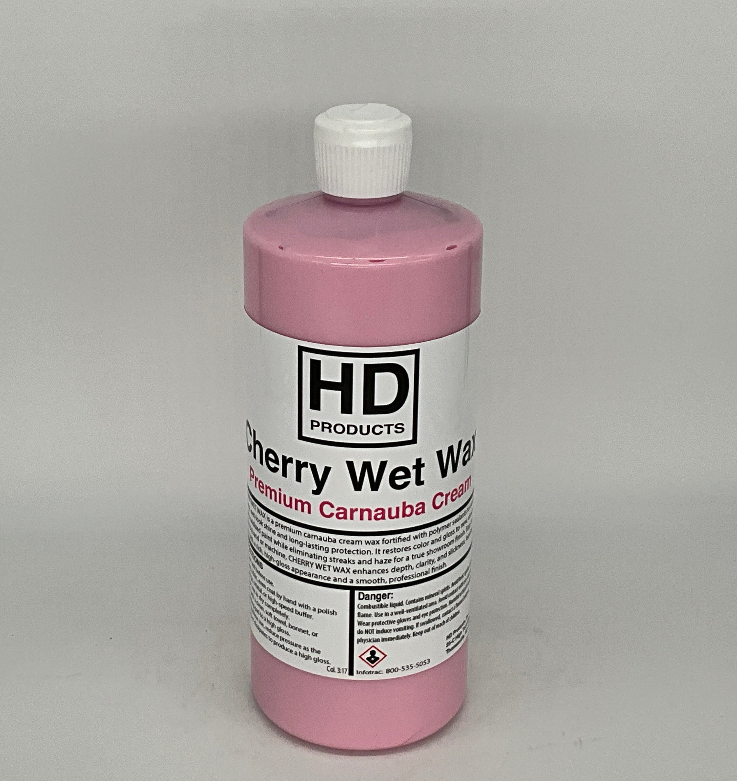 32oz Pink bottle of HD Products Cherry Wet Wax on a gray background