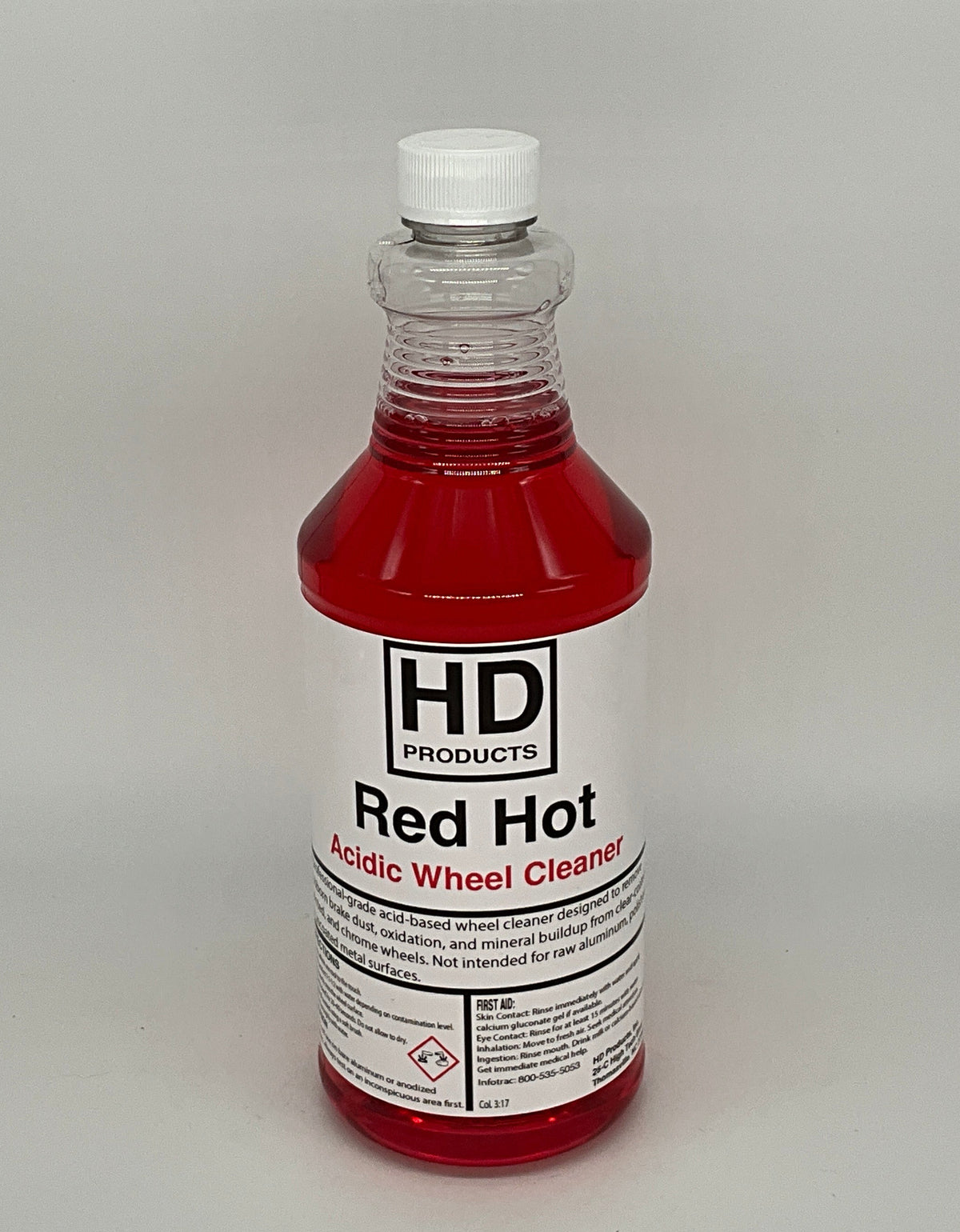 32oz clear bottle of HD Red Hot wheel cleaner on a gray background