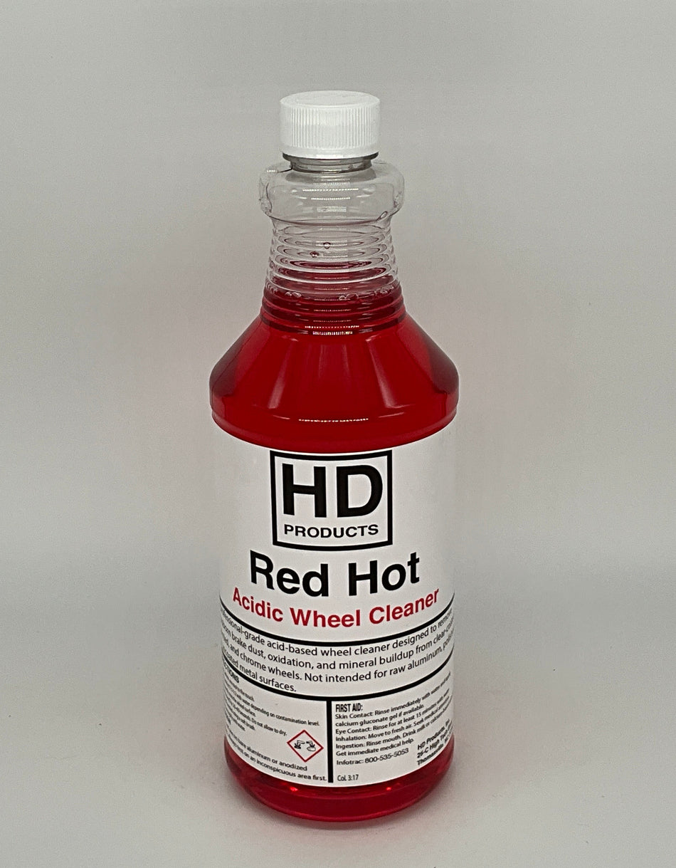 32oz clear bottle of HD Red Hot wheel cleaner on a gray background