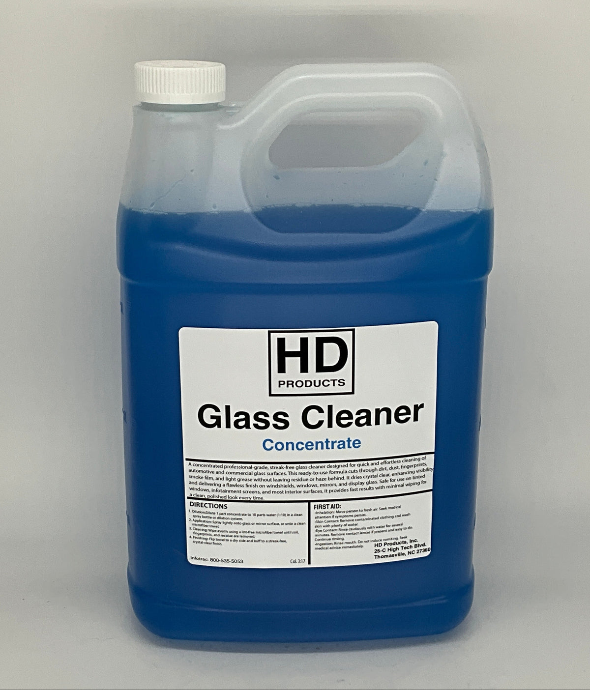 1 gallon of HD  glass cleaner concentrate container with a white label on a gray background
