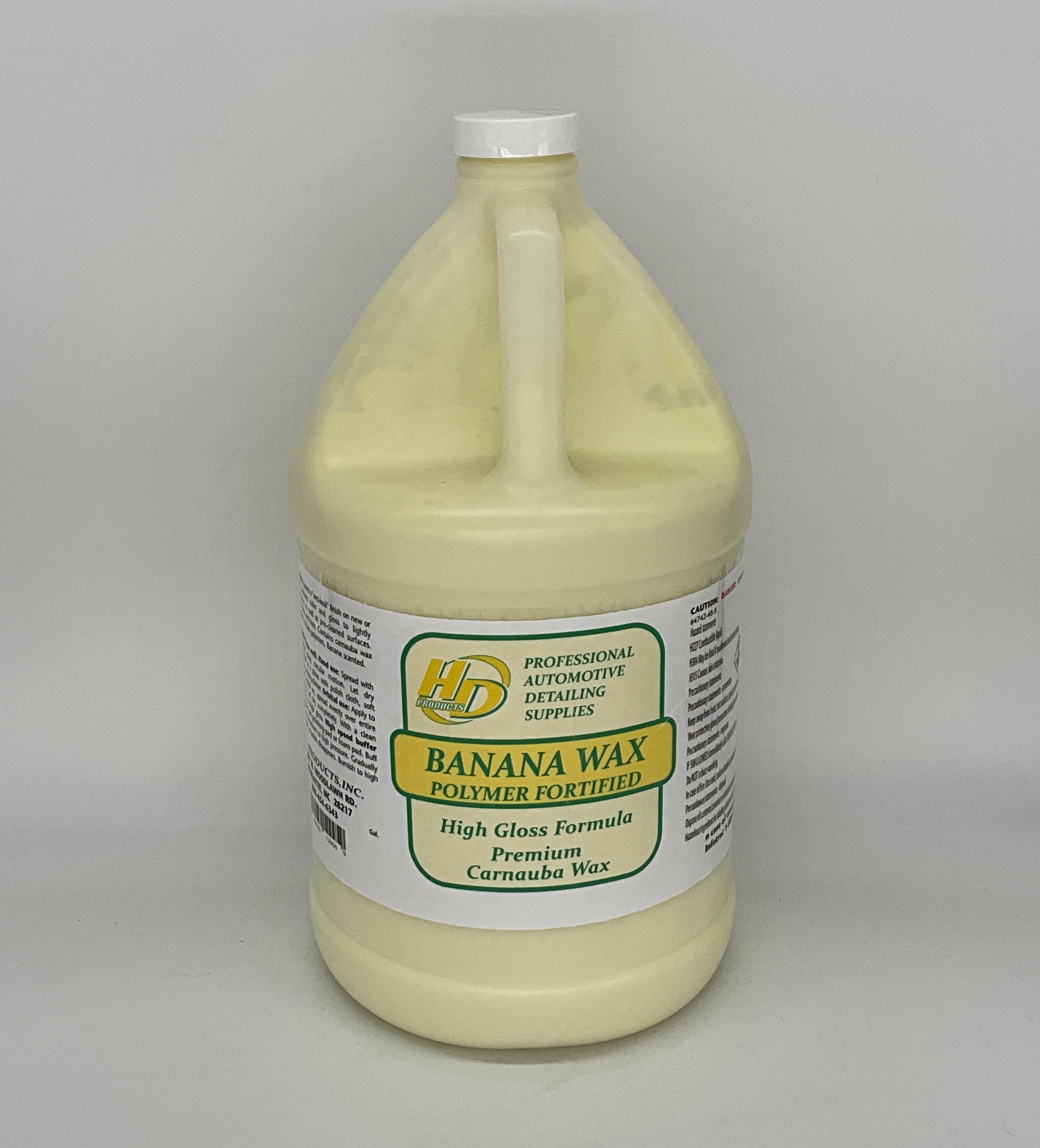 1 Gallon container of banana wax polymer on a gray background