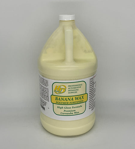 1 Gallon container of banana wax polymer on a gray background