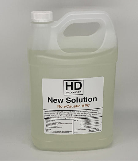 1 gallon of HD Products New Solution Non-Caustic APC on a gray background